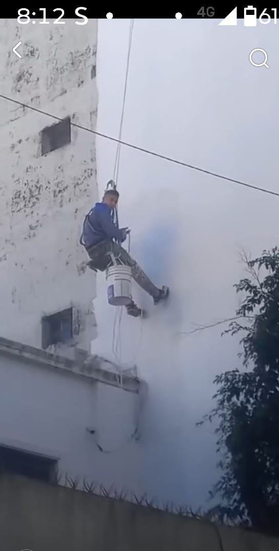 Trabajo en altura sobre silleta — pintura de frente